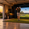 Home golf simulator in a garage with an impact screen, enclosure and hitting mat